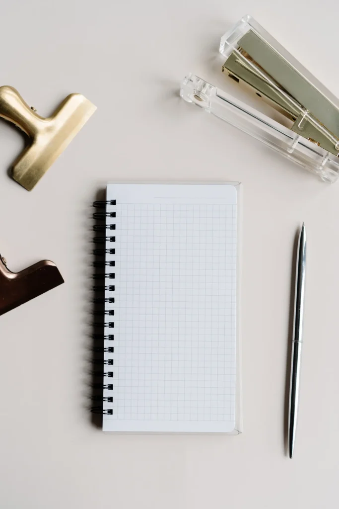 notebook and pen on clean desk as structured blog planning for SEO