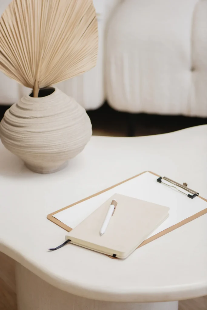 clipboard and pen on neutral desk representing structured content strategy planning