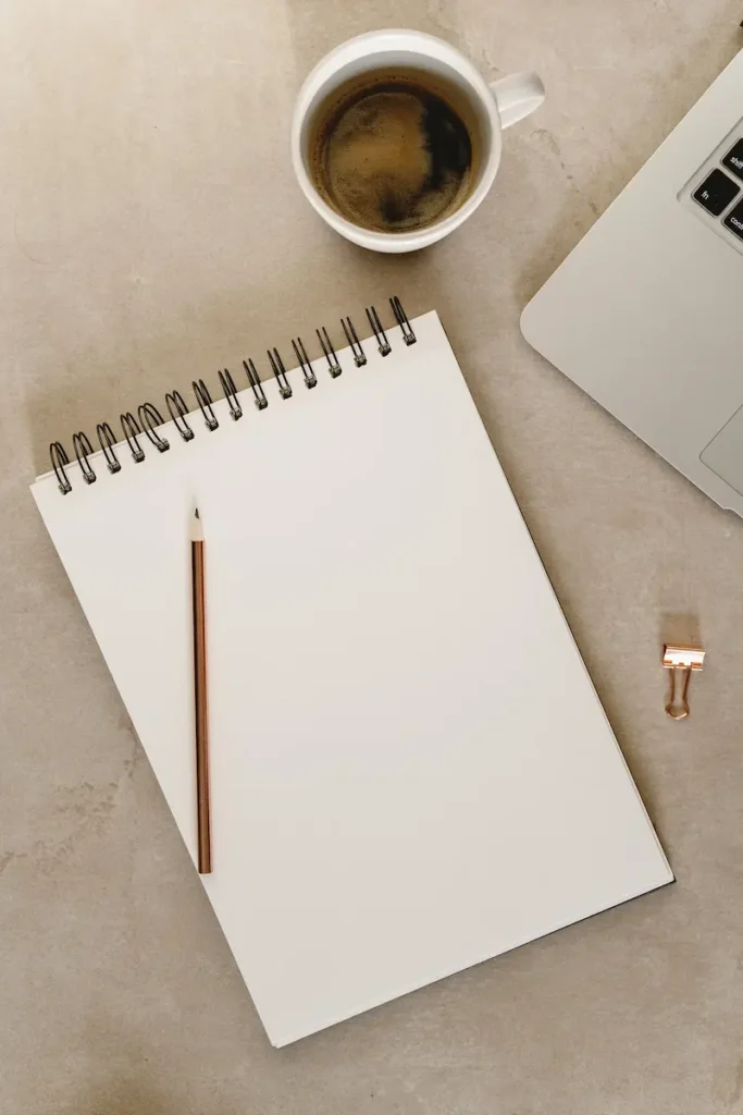 planning and evaluating an online business purchase with notebook and coffee