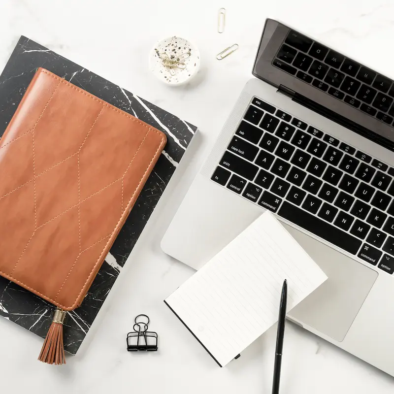 laptop and notebook workspace for website investing and analysis