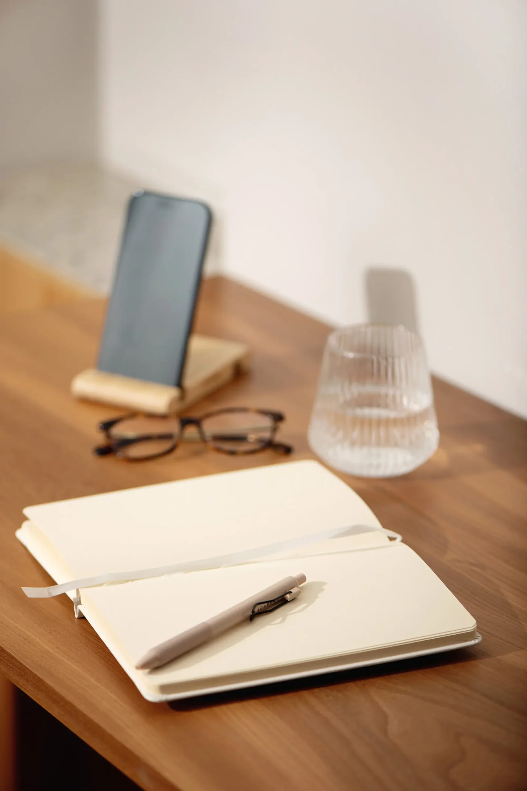 notebook and phone on wooden desk introducing blog flipping basics