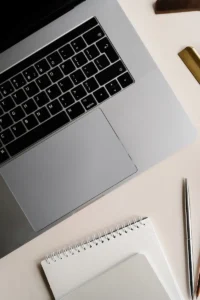 laptop and notebook on desk representing structured blog setup for SEO