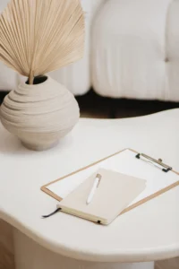 clipboard and pen on neutral desk representing structured content strategy planning